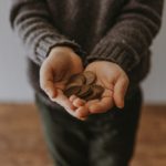Child holding pocket money change