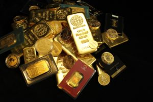 Pile of gold bullion coins and bars. Argor Heraeus, Münze Österreich, Royal Canadian Mint, U.S. Mint, Australian Mint of Perth, panda and Krugerrand. If you use our photos, please add credit to https://zlataky.cz, when possible